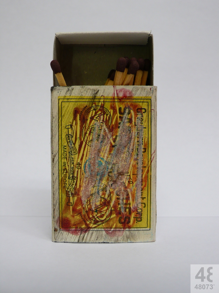 Small abstract painting on matchbox.