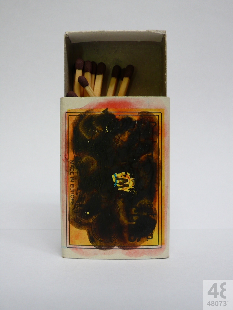 Small abstract painting on matchbox.