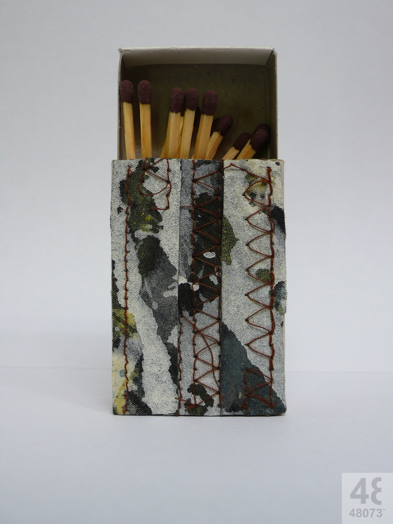 Small abstract painting on matchbox.