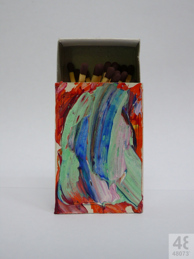 Small abstract painting on matchbox.