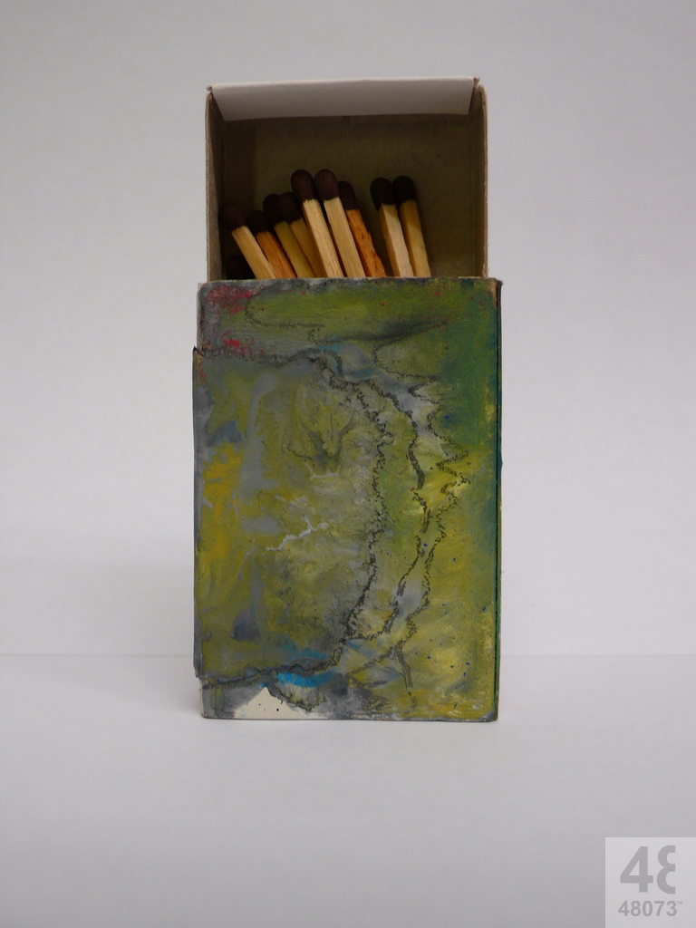 Small abstract painting on matchbox.