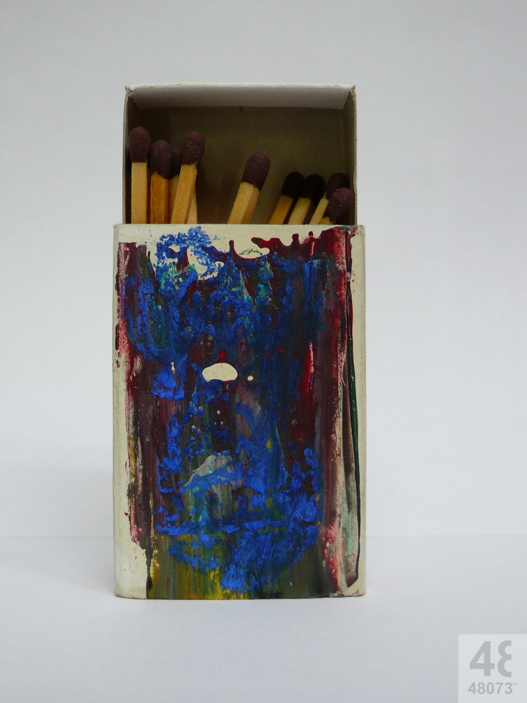 Small abstract painting on matchbox.