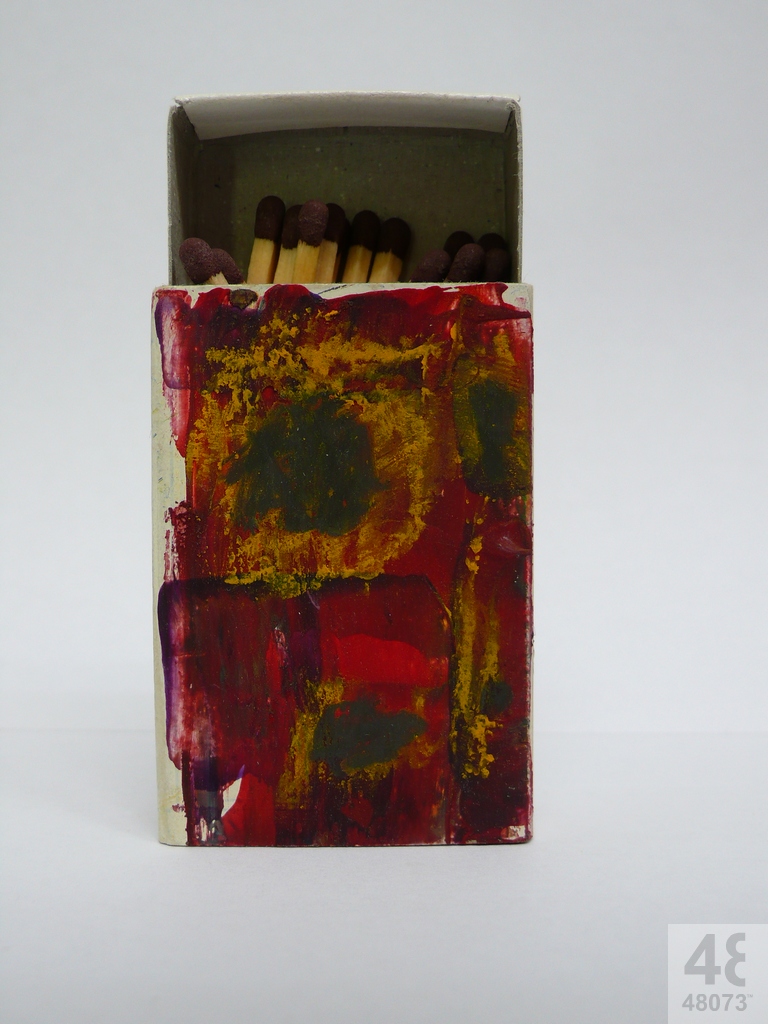 Small abstract painting on matchbox.