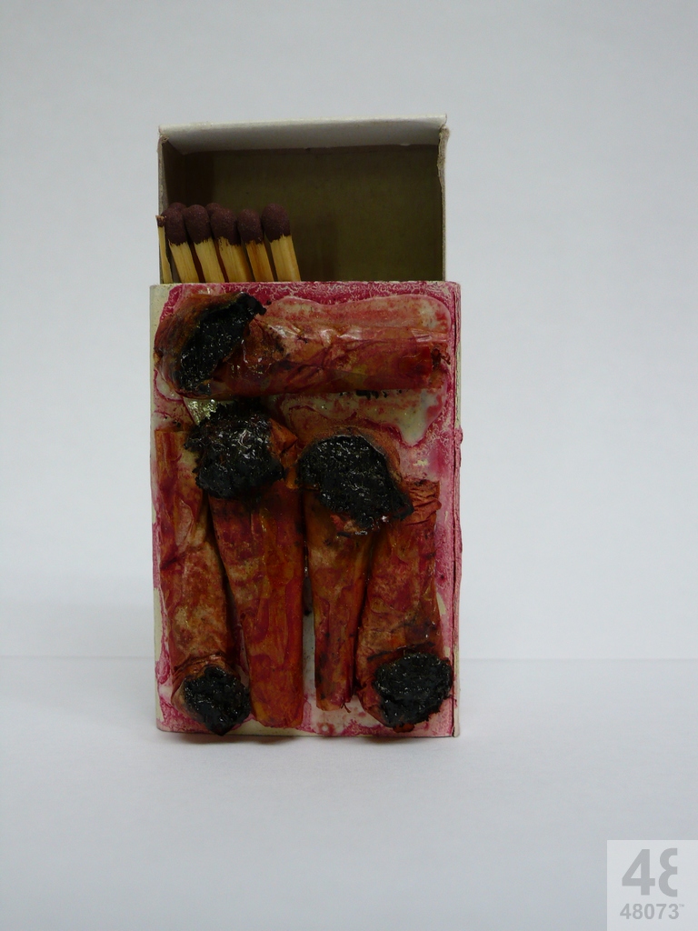 Small abstract painting on matchbox.