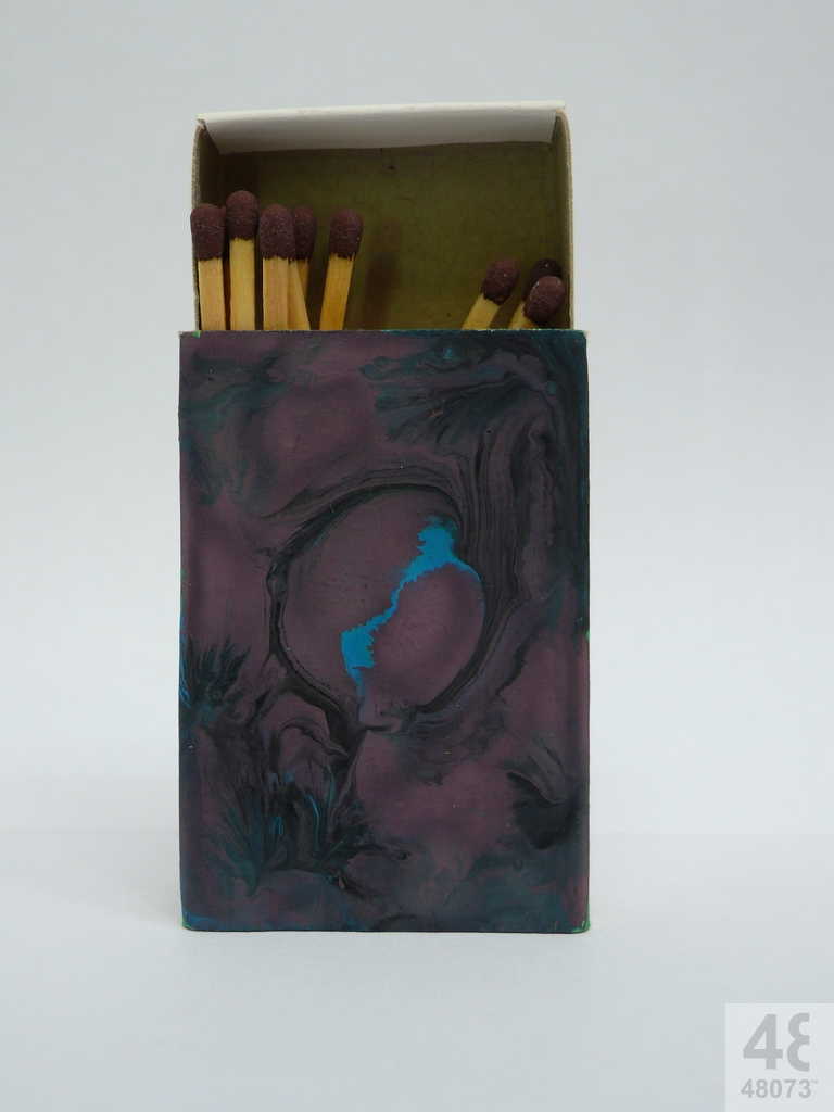 Small abstract painting on matchbox.