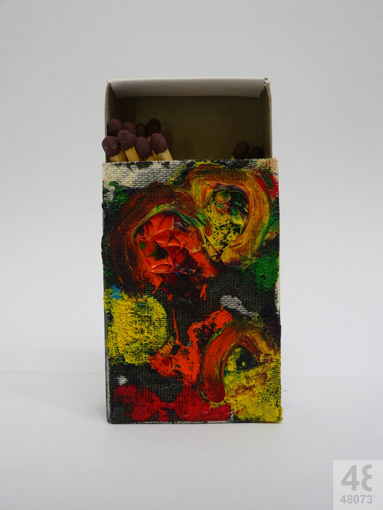 Small abstract painting on matchbox.