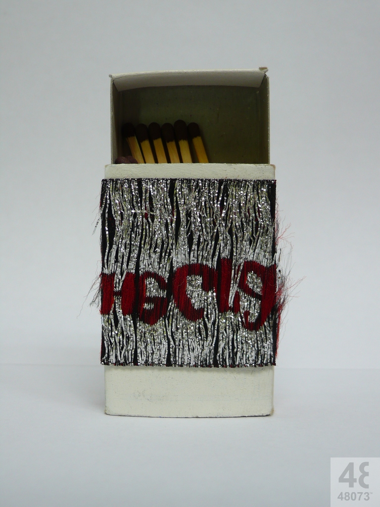 Small abstract painting on matchbox.