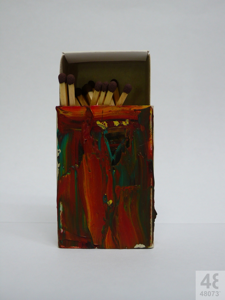 Small abstract painting on matchbox.