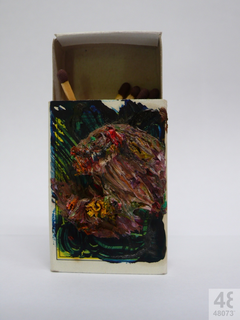 Small abstract painting on matchbox.