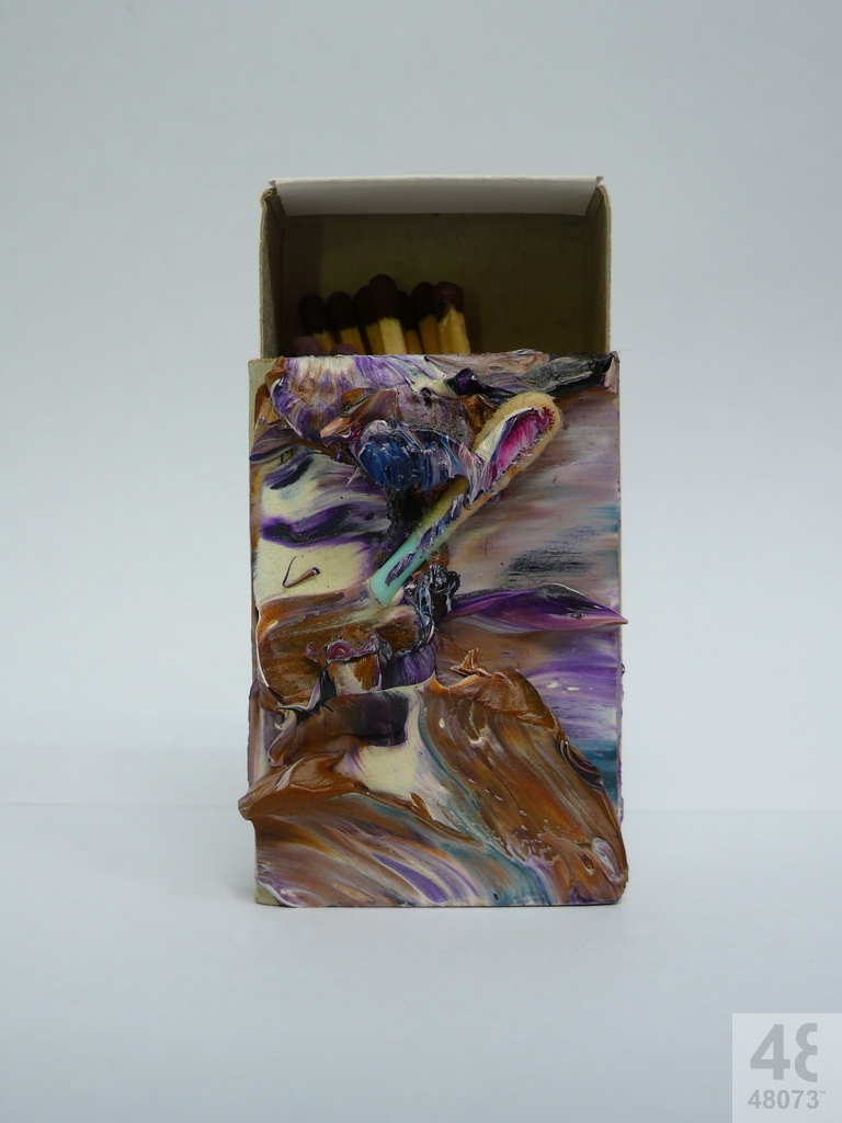 Small abstract painting on matchbox.