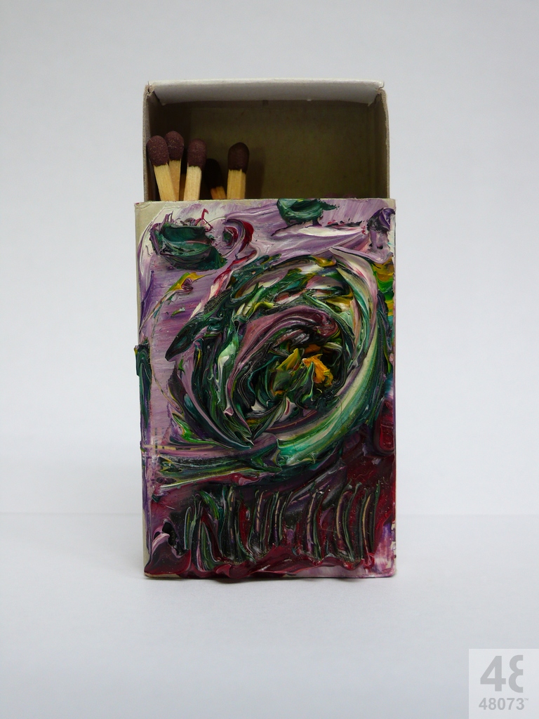 Small abstract painting on matchbox.