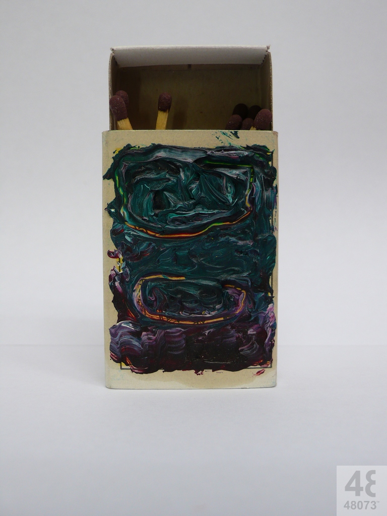 Small abstract painting on matchbox.