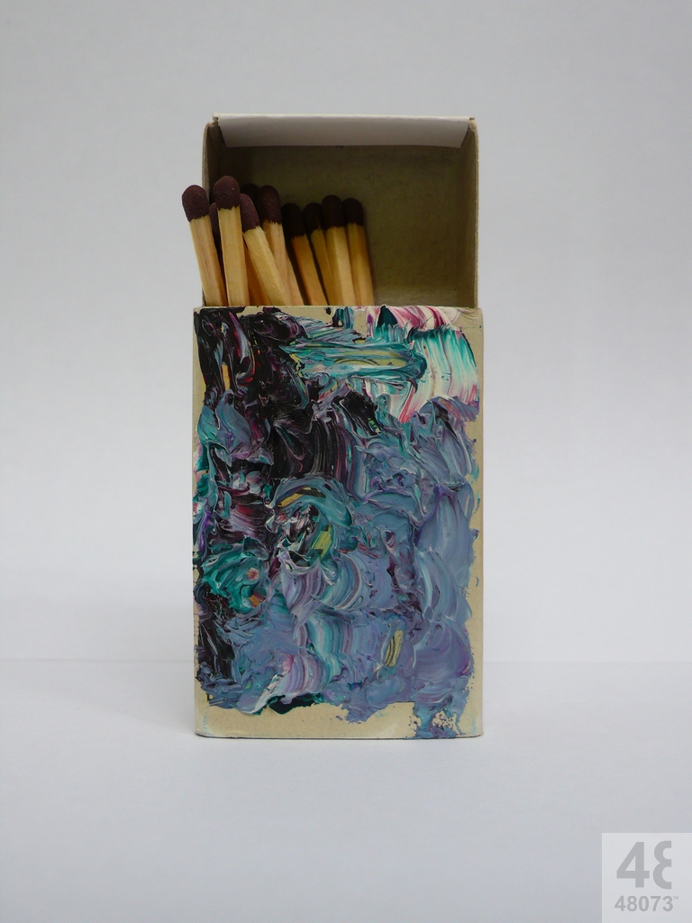 Small abstract painting on matchbox.