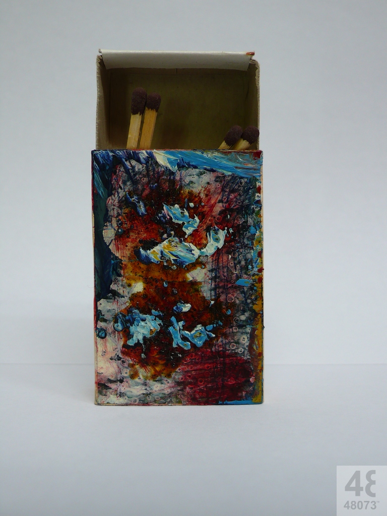 Small abstract painting on matchbox.