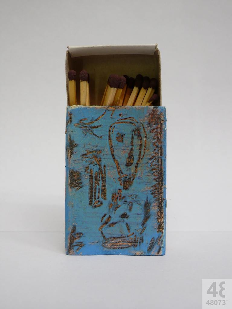 Small abstract painting on matchbox.