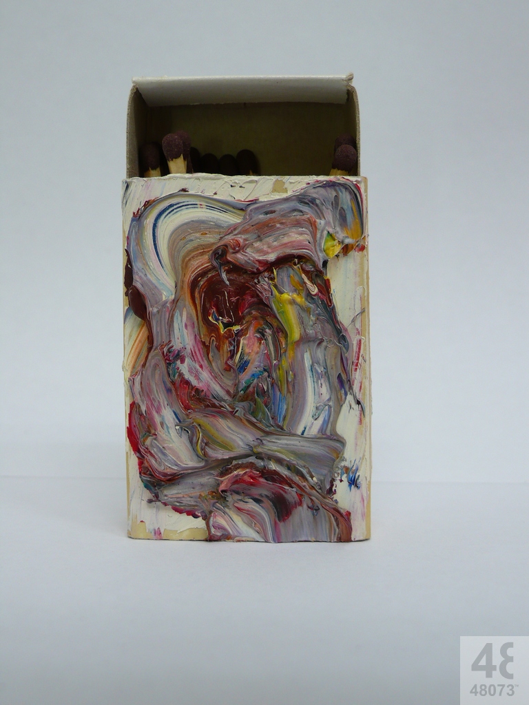 Small abstract painting on matchbox.