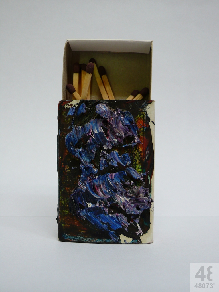 Small abstract painting on matchbox.