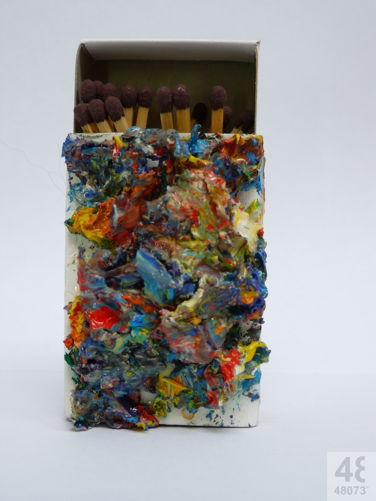 Small abstract painting on matchbox.