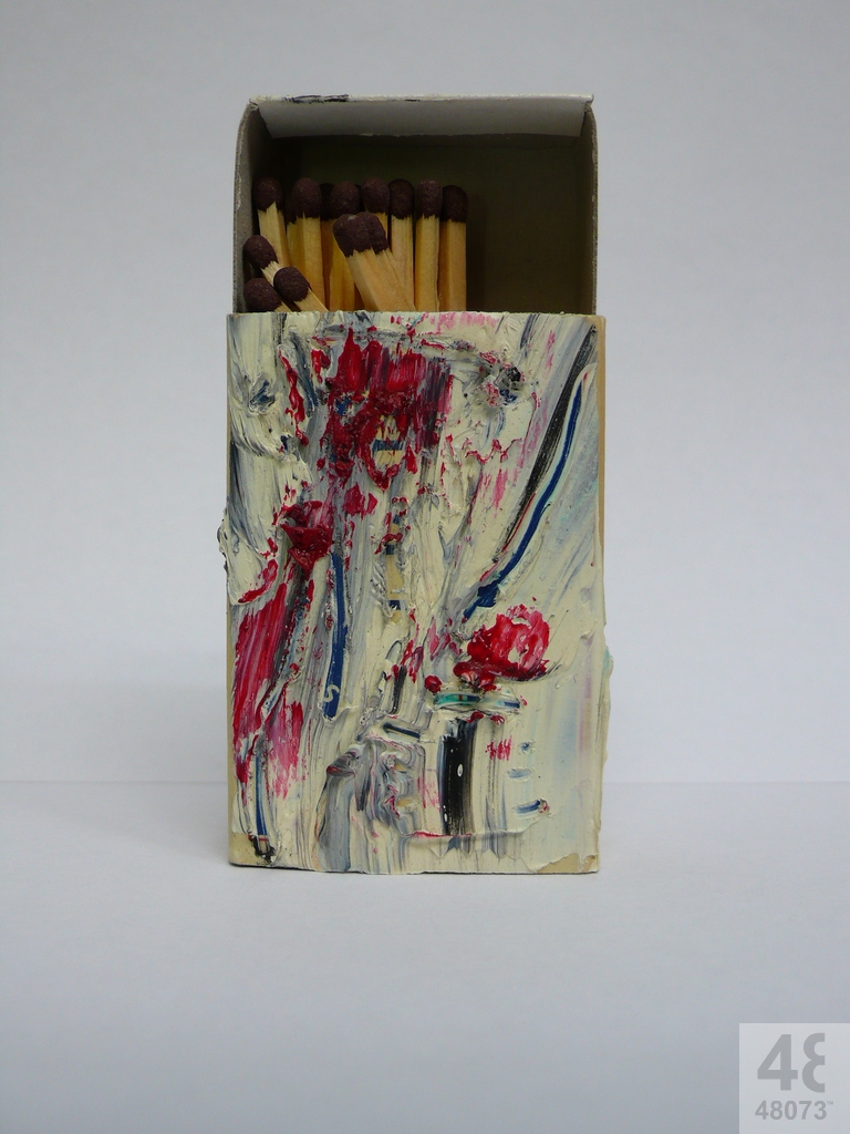 Small abstract painting on matchbox.