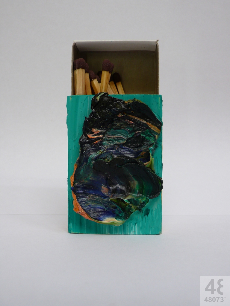 Small abstract painting on matchbox.
