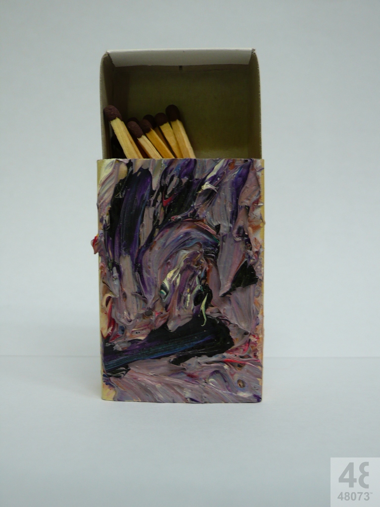 Small abstract painting on matchbox.