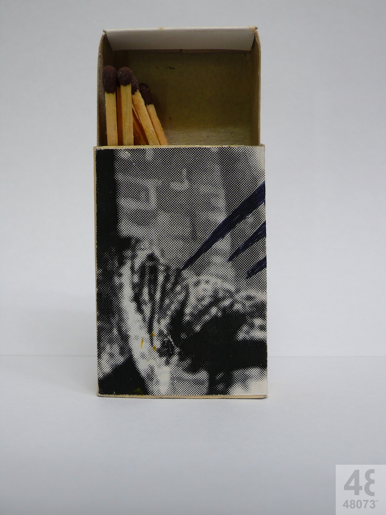 Small abstract painting on matchbox.