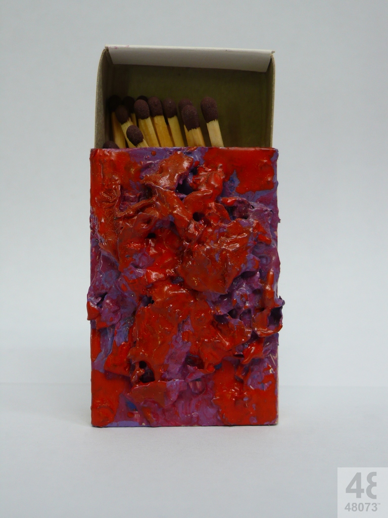 Small abstract painting on matchbox.