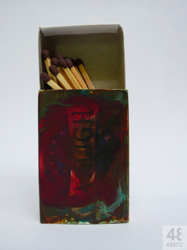Small abstract painting on matchbox.