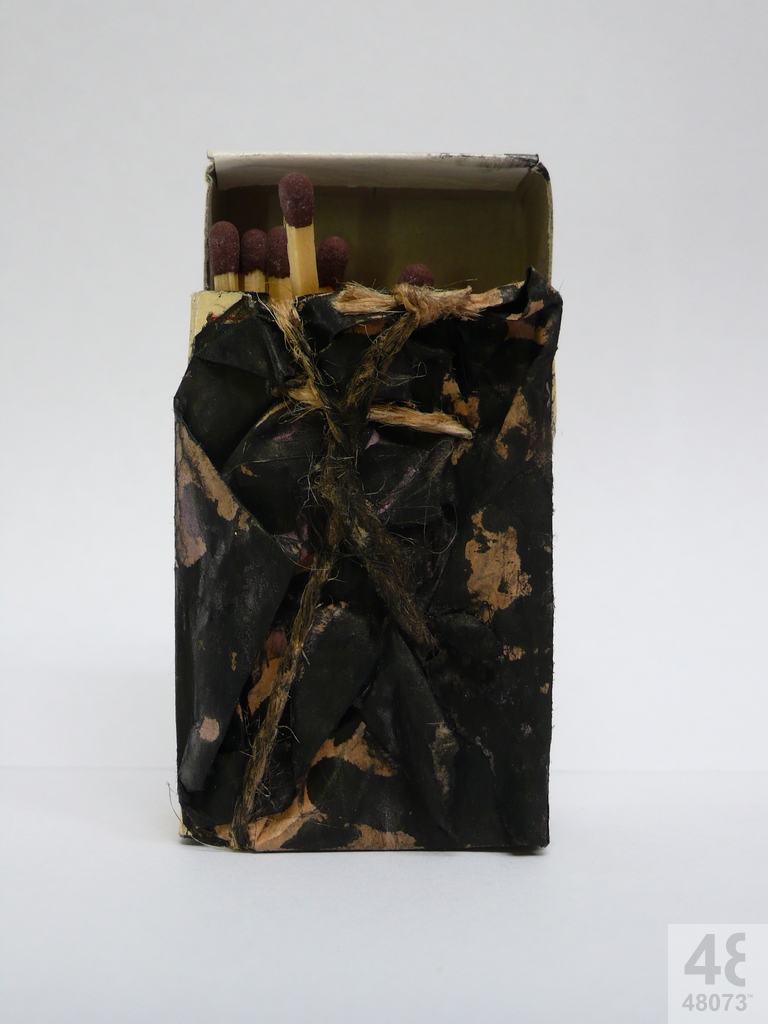 Small abstract painting on matchbox.