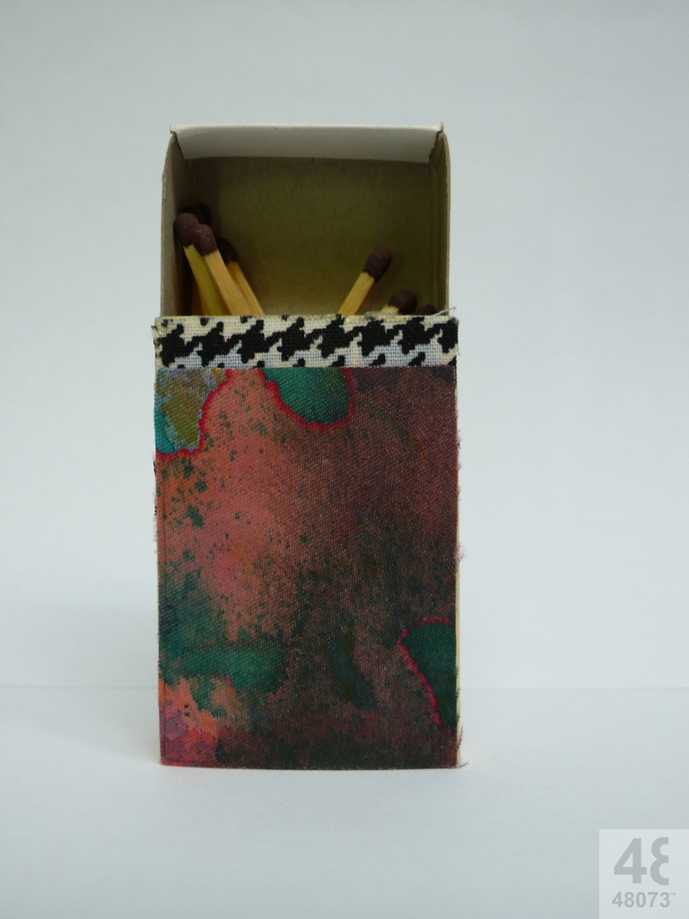 Small abstract painting on matchbox.