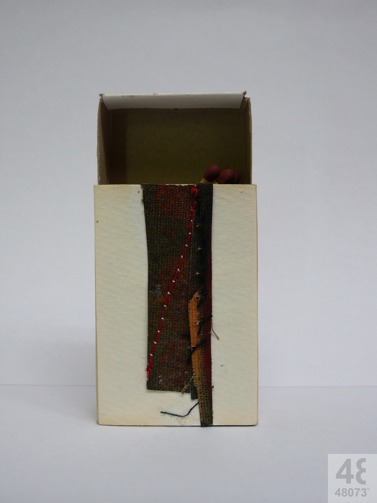 Small abstract painting on matchbox.