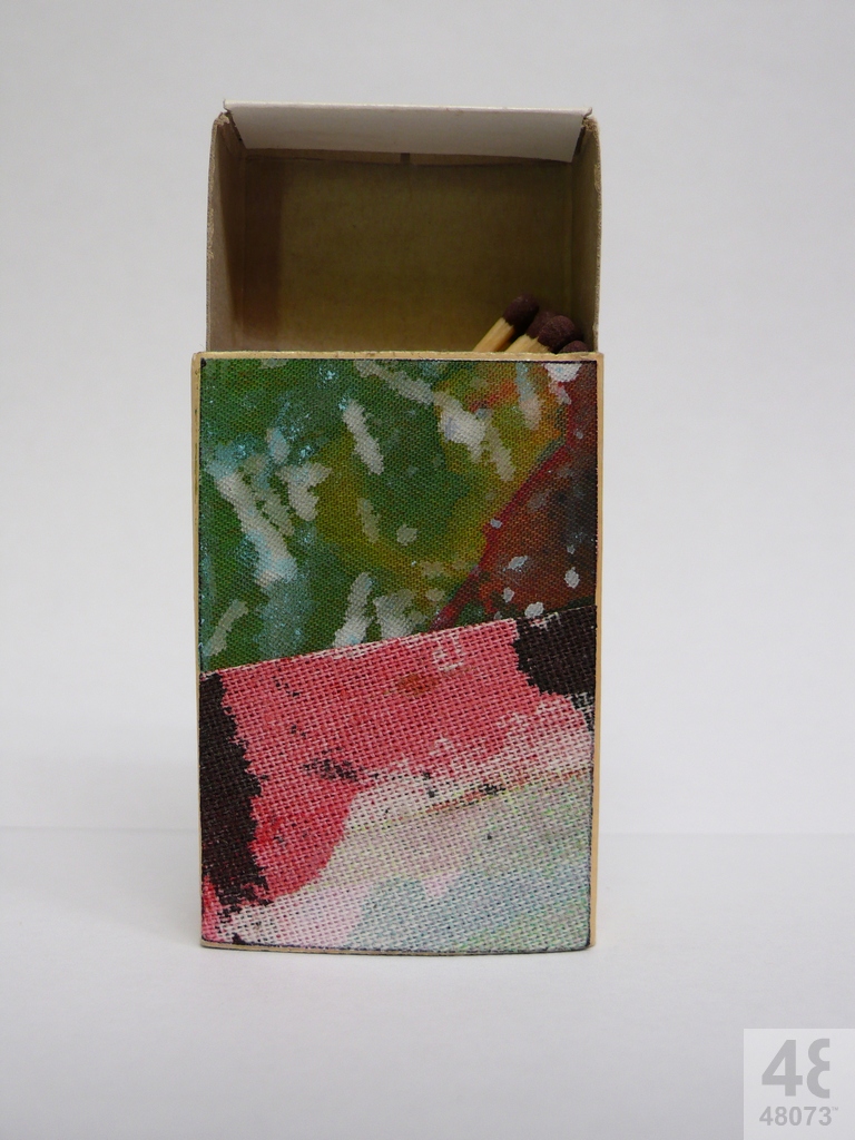 Small abstract painting on matchbox.