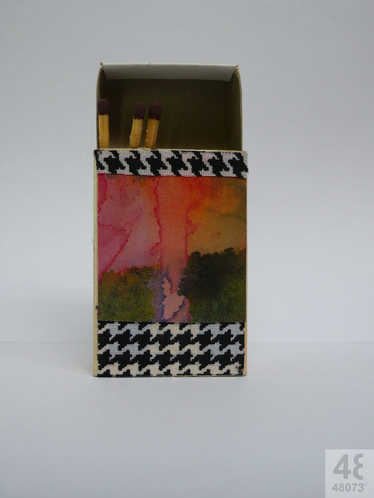 Small abstract painting on matchbox.