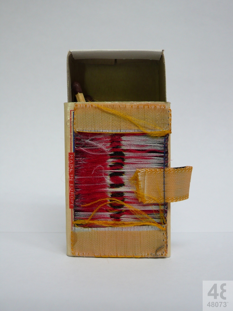 Small abstract painting on matchbox.