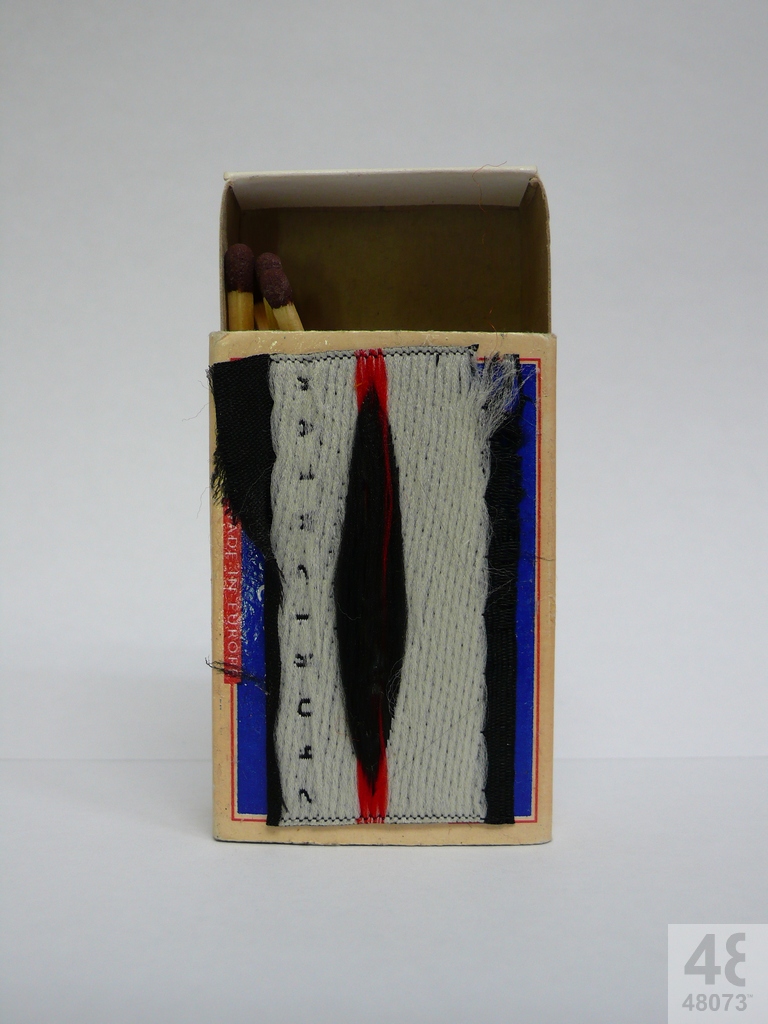 Small abstract painting on matchbox.