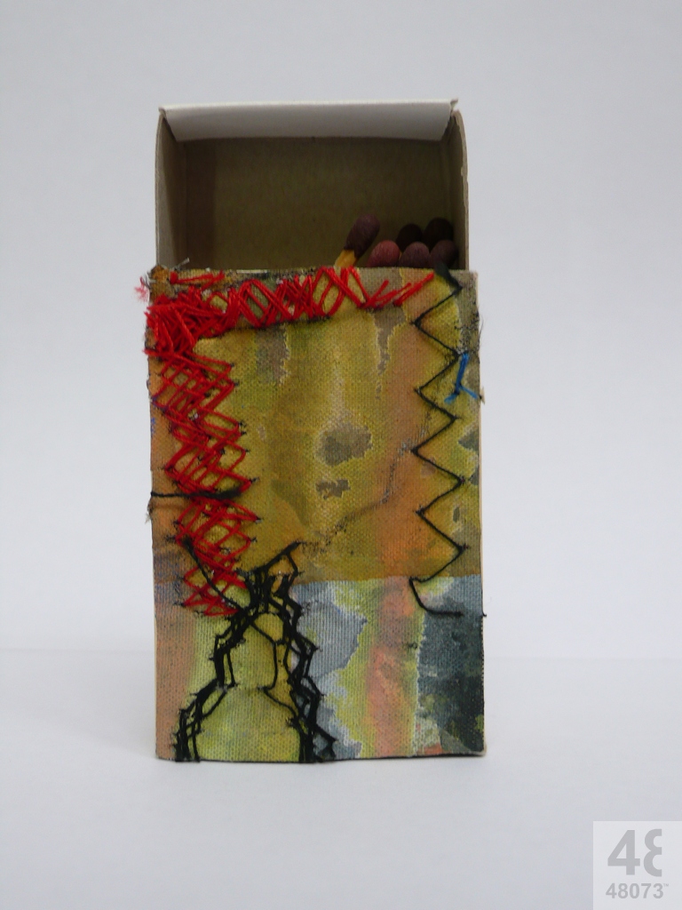 Small abstract painting on matchbox.