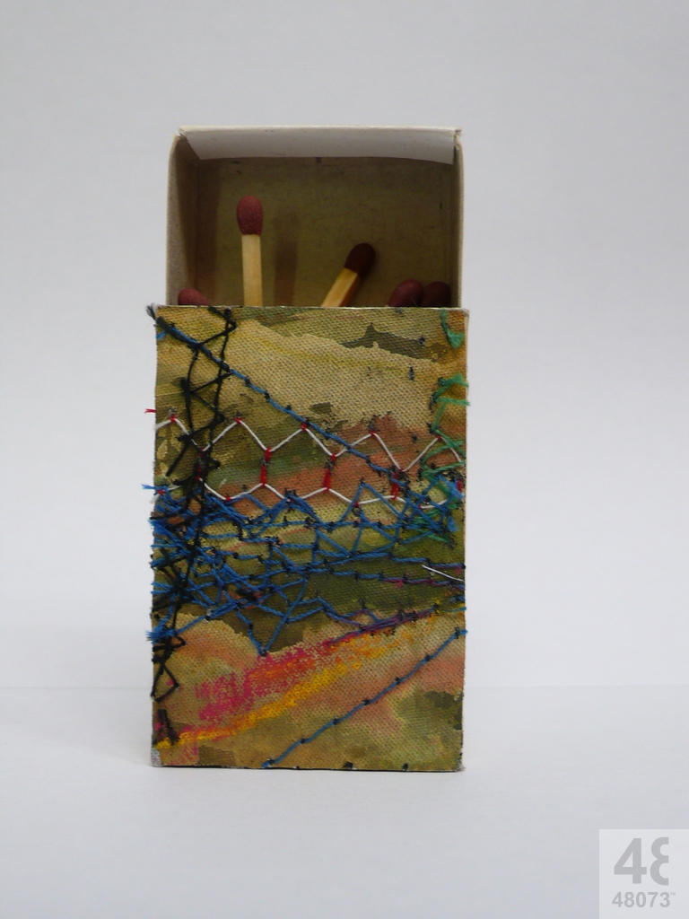 Small abstract painting on matchbox.