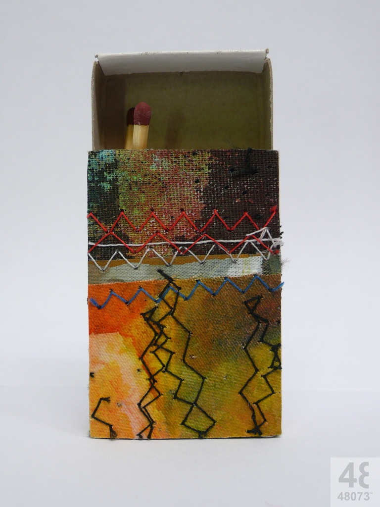 Small abstract painting on matchbox.