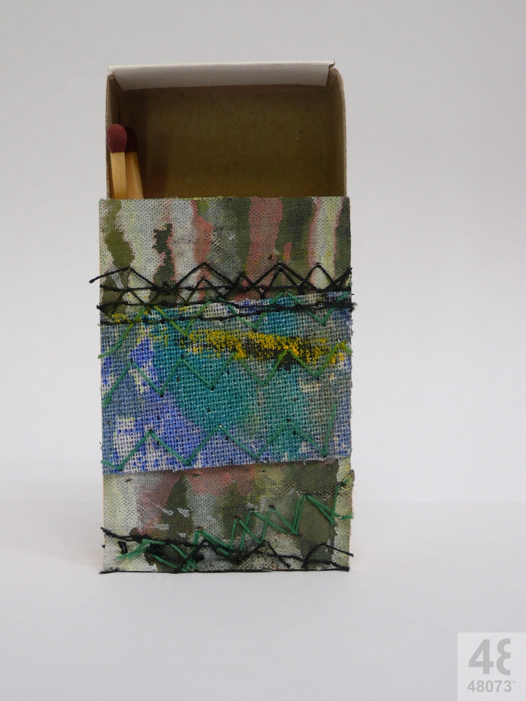 Small abstract painting on matchbox.