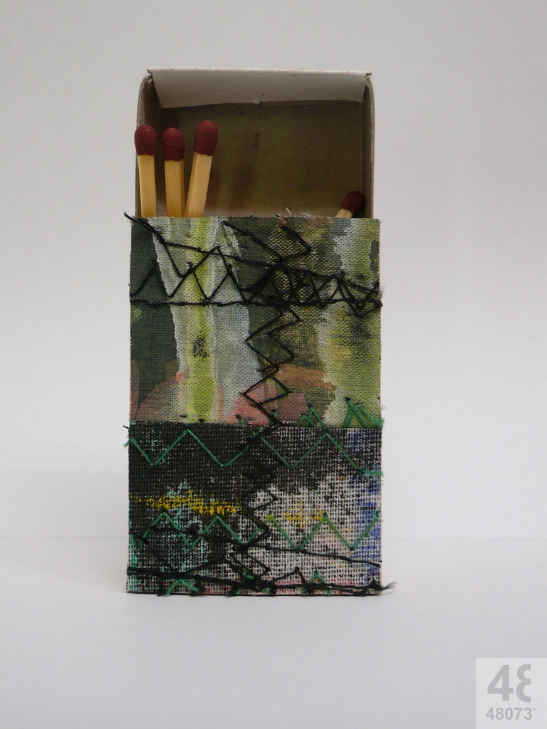 Small abstract painting on matchbox.