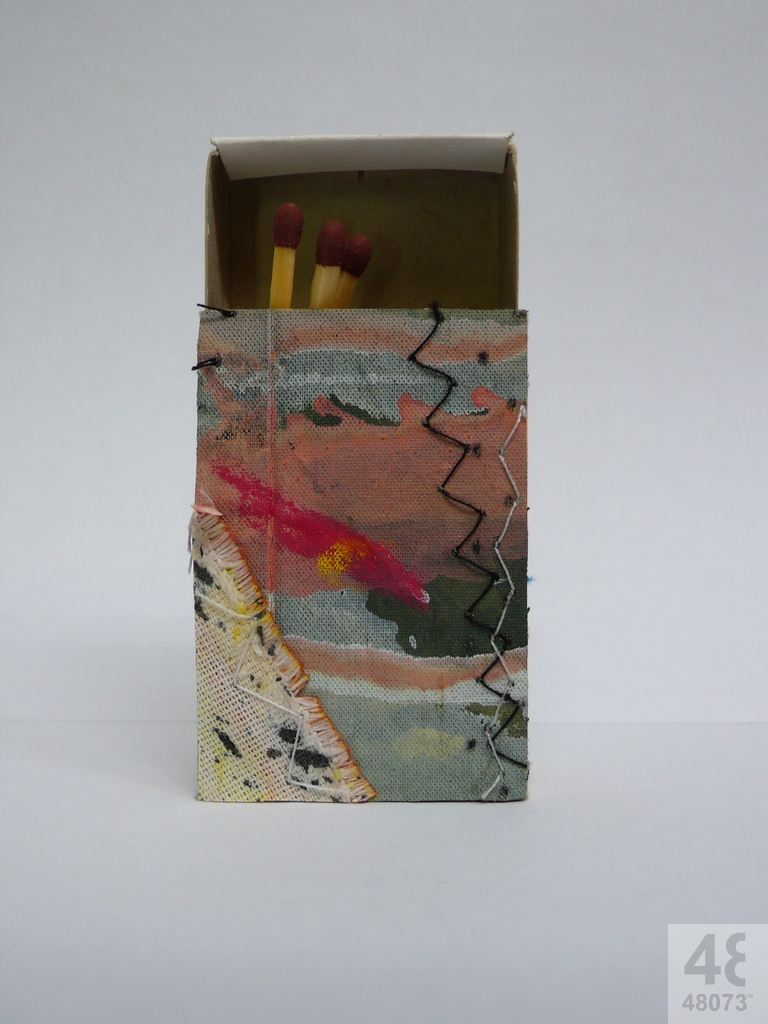 Small abstract painting on matchbox.