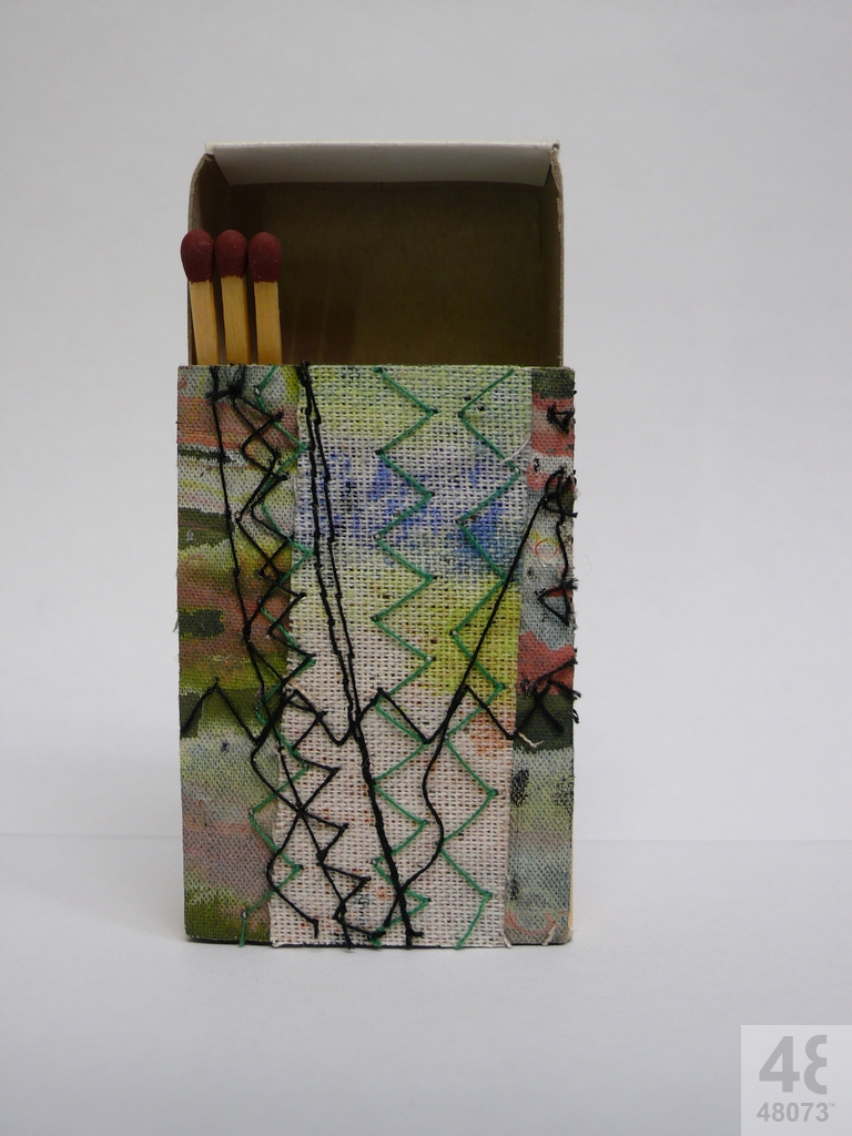 Small abstract painting on matchbox.