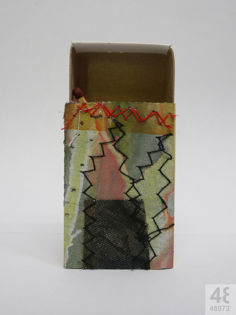 Small abstract painting on matchbox.