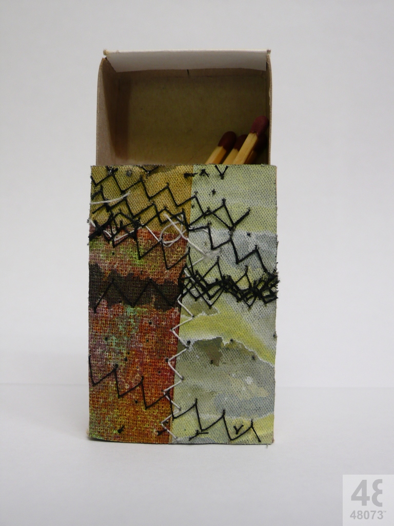 Small abstract painting on matchbox.