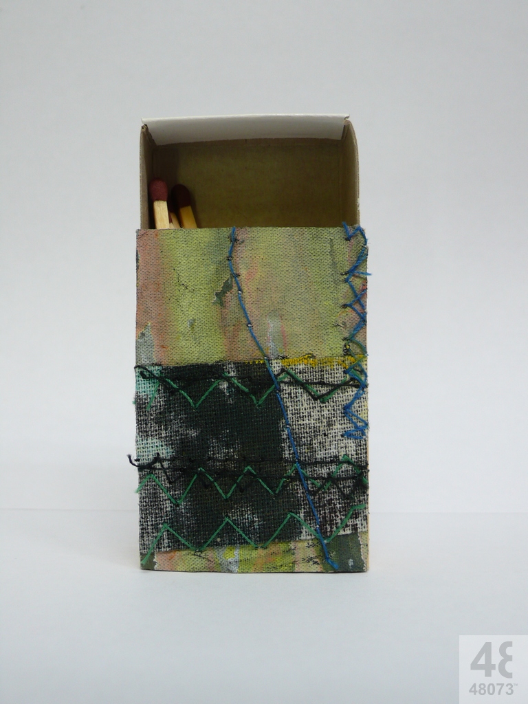 Small abstract painting on matchbox.