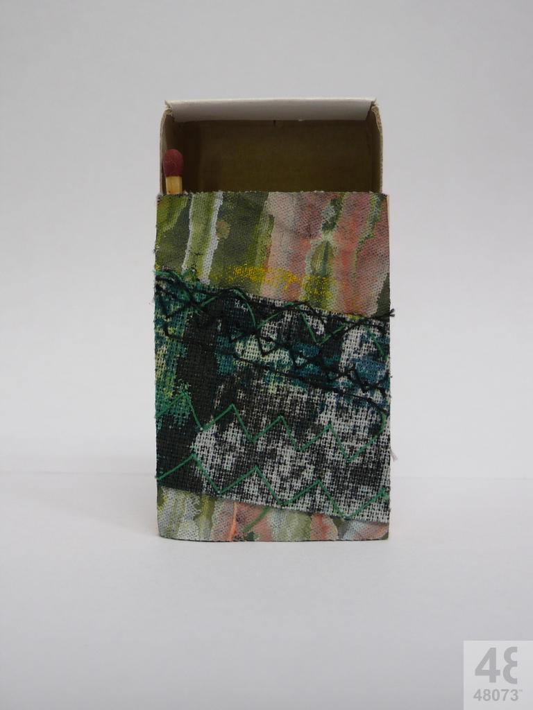 Small abstract painting on matchbox.