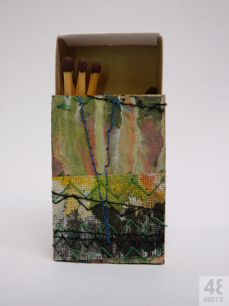 Small abstract painting on matchbox.