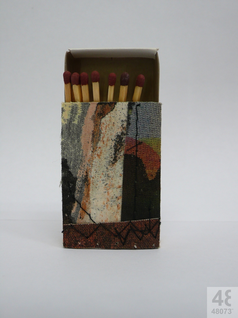 Small abstract painting on matchbox.