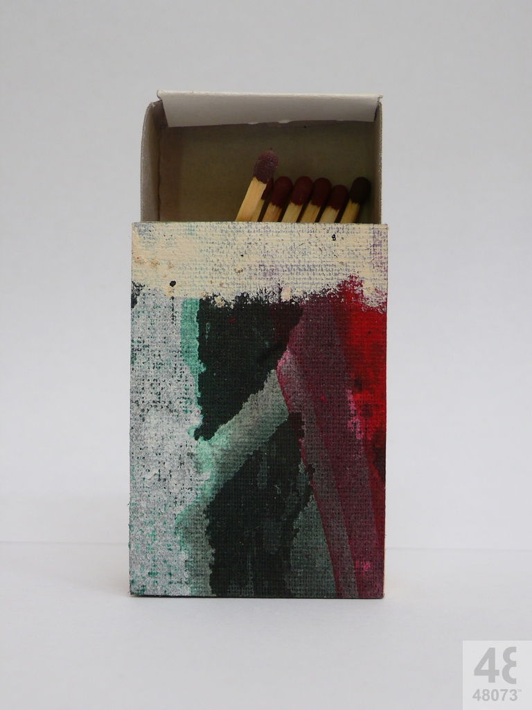 Small abstract painting on matchbox.