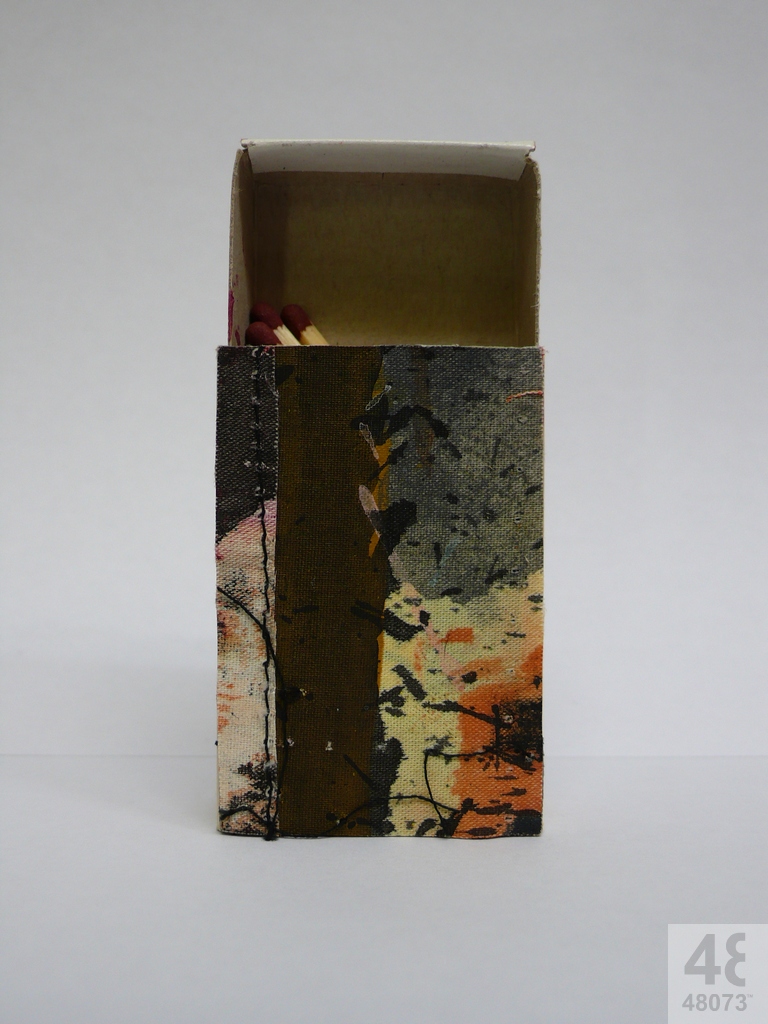 Small abstract painting on matchbox.